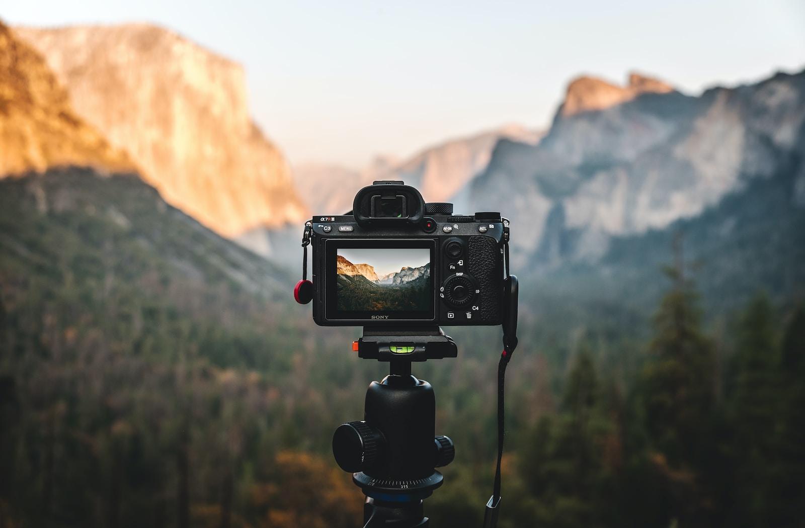 a camera is set up to take a picture of mountains